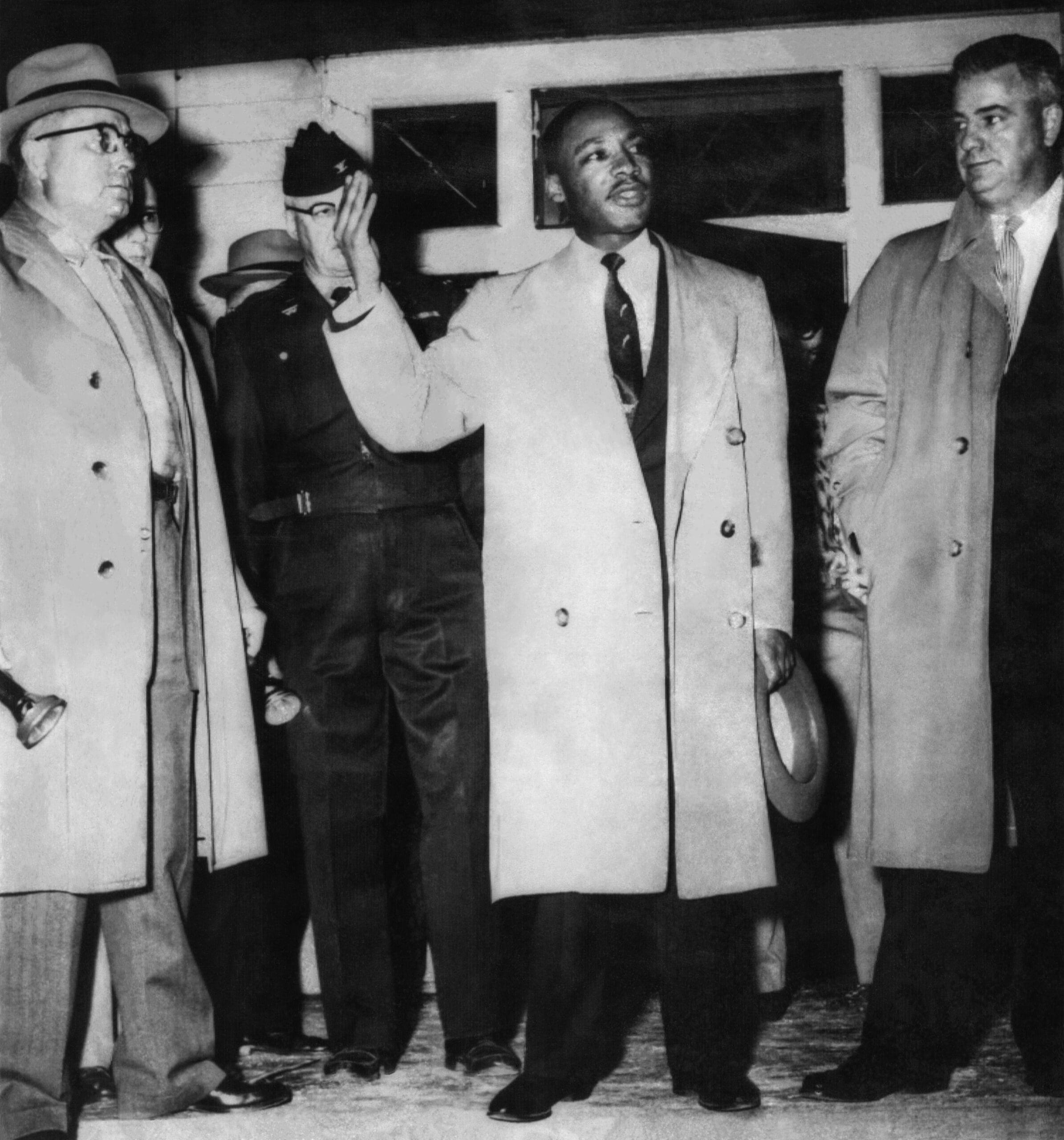Dr. Martin Luther King, Jr. addressing a crowd from his front porch after his home in Montgomery, Alabama was bombed on January 30,1956.